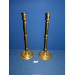 An imposing pair of George III Brass altar Candlesticks, 17'' tall.