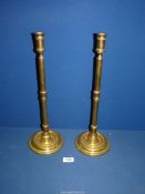 An imposing pair of George III Brass altar Candlesticks, 17'' tall.