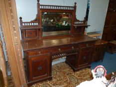 An Edwardian Mahogany/Walnut Sideboard having three frieze drawers,