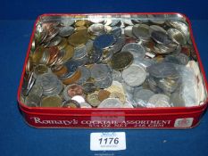 A tin of UK and Foreign coins and Foreign notes.