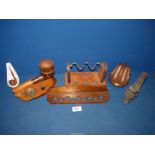 A box of pipe stands and racks including a leather covered stand, a huge pipe ashtray,