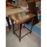A rectangular Oak occasional Table standing on twist legs with perimeter stretchers,