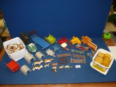 A quantity of Britains models including metal and some plastic farming equipment and accessories;