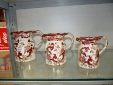 A graduated set of three Mason's Red Mandalay jugs.