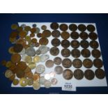 A tin of old coins including; foreign and Great Britain, some Queen Victoria pennies, etc.