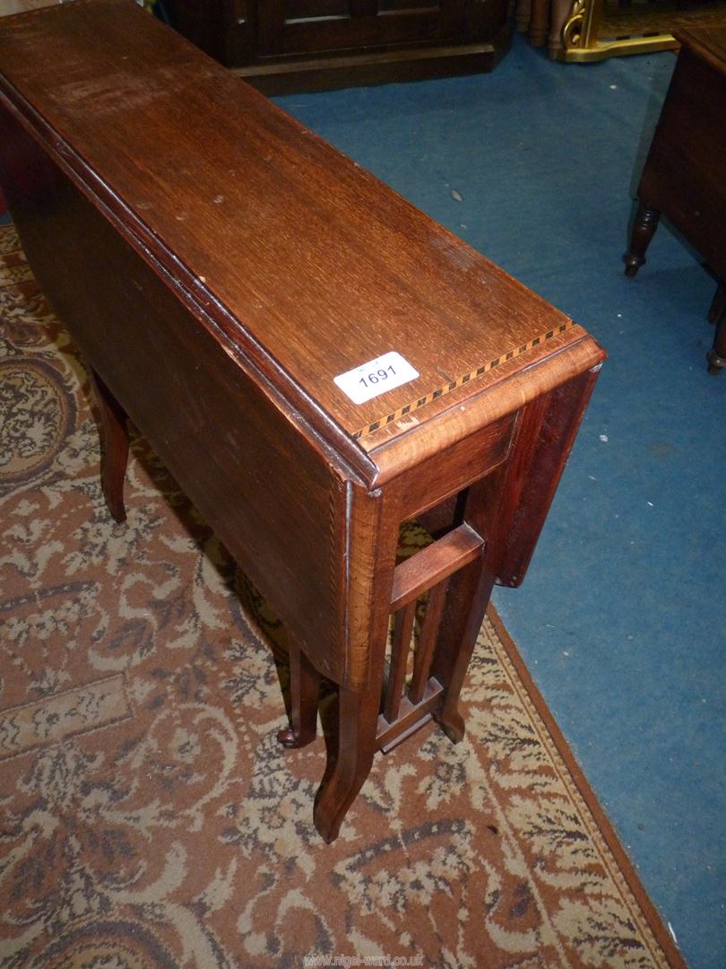 A Mahogany Sutherland Table having light and darkwood rope stringing to the top and raised on - Image 3 of 3