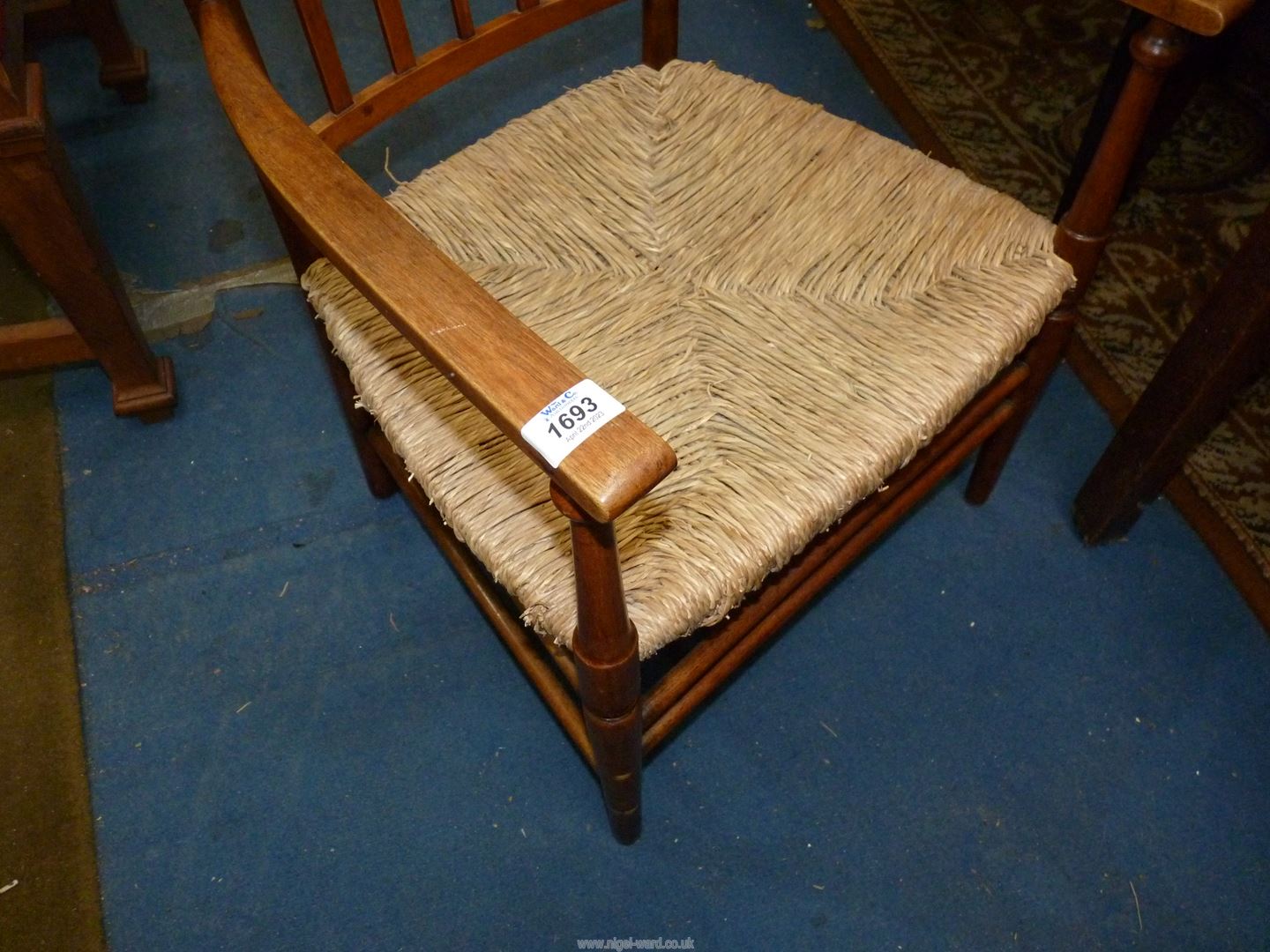 An elegant mixed woods Arts and crafts design open armed Elbow Chair having a fretworked central - Image 4 of 4