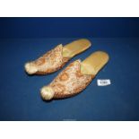 A pair of ladies Moorish slippers with leather soles and gold threaded embroidery.