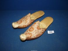 A pair of ladies Moorish slippers with leather soles and gold threaded embroidery.