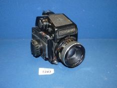 A Mamiya 645 M645 Medium Format SLR Camera with Prism Finder and Mamiya Sekor C 80mm f/2.8 lens.