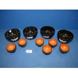 Four lacquered bowls with dragonfly pattern and six lacquered egg cups.