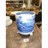 An Adams Tunstall blue and white Jardiniere with cattle scenes and on three paw feet,