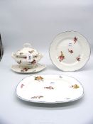 An early Staffordshire matching dinner plate, platter and sauce tureen with stand,