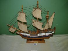 A model of the Golden Hinde mounted on wooden plinth, 19" x 18".