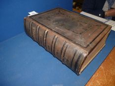 A large Leather bound copy of 'The Holy Bible with a Devotional and Practical Commentary' by Rev R.