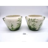 A pair of vases in white with scene of trees by water with sailing boat, 4 1/2" tall.