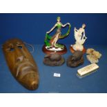 A quantity of miscellanea including wooden tribal mask, hedgehog, badger figures, dancing figures,