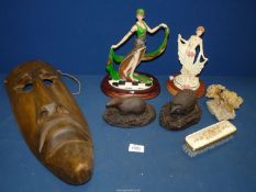A quantity of miscellanea including wooden tribal mask, hedgehog, badger figures, dancing figures,