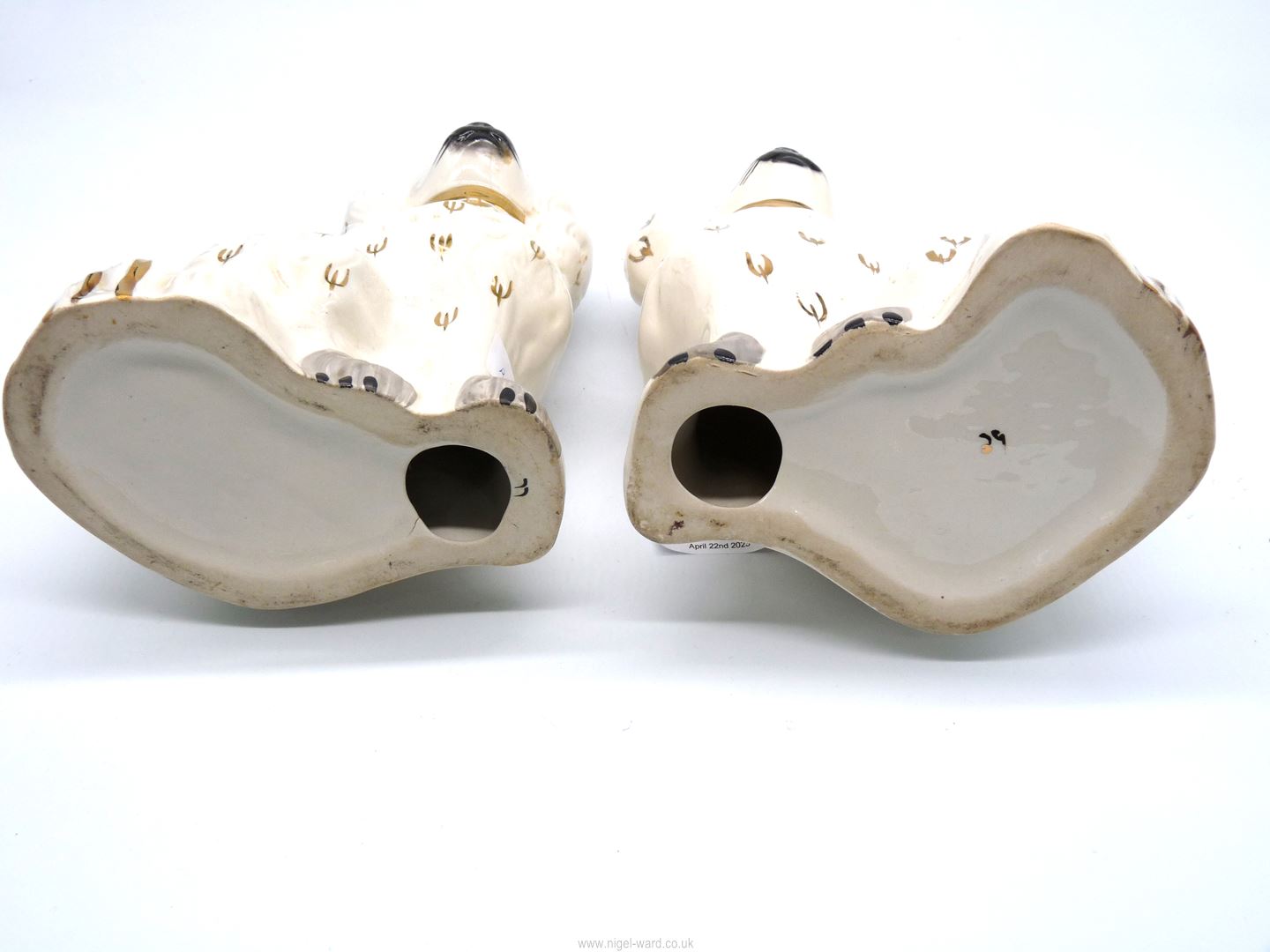 A pair of Staffordshire style white mantle Spaniels with gold collars and padlocks, with grey paws, - Image 2 of 2