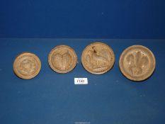 Four treen Butter stamps/moulds engraved with 'heart', 'thistle',