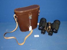 A pair of Dolland 10 x 50 Binoculars in leather case.