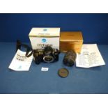 A Minolta Dynax 700si SLR camera body and a Sigma 28-105mm F/4-5.6 lens, both boxed.