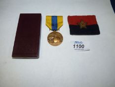 An Indian General Headquarters woven cloth Formation Badge and a Somme Combattants Medal