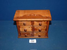 A small Apprentice chest of drawers, 7" wide x 3 1/2" deep x 7" high.