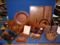 A quantity of treen items including; trays, book troughs, etc.