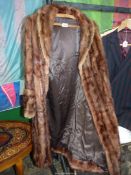A brown Fur Coat with deep cuff sleeves