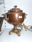 A copper Samovar with brass tap.