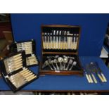 A canteen of mixed cutlery and two display boxes including fish knives and forks, cake server,