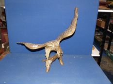 A large brass Eagle with outstretched wings, 21 1/2" tall.
