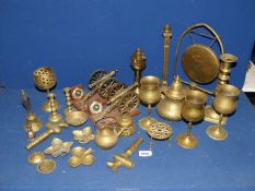 A quantity of brass including candlesticks, dinner gong, cannons, etc.