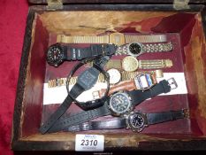 A rosewood trinket Box containing Watches including "Casio alarm chrono" and a flip-action quartz
