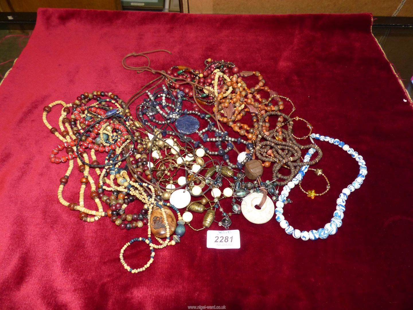 A box containing vintage bead necklaces to include; some wooden, etc.