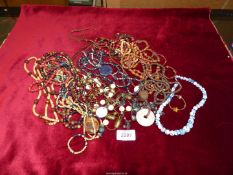 A box containing vintage bead necklaces to include; some wooden, etc.