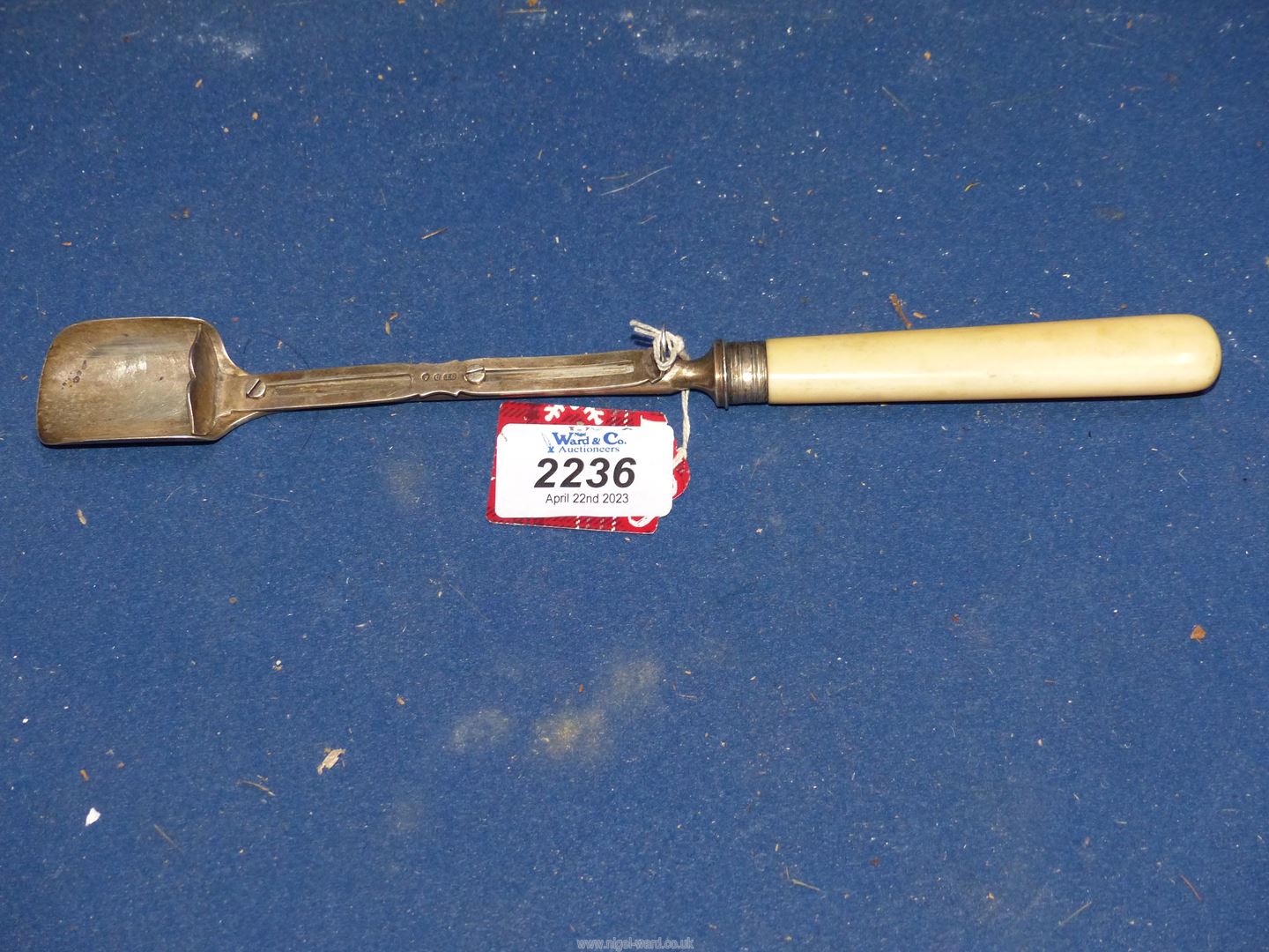 A bone handled Silver Stilton scoop with pusher, Birmingham 1869 (split in handle).