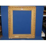 A large Victorian gilt gesso picture frame, aperture 17'' x 22 1/2'',