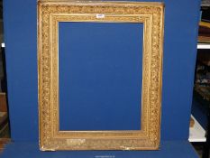 A large Victorian gilt gesso picture frame, aperture 17'' x 22 1/2'',