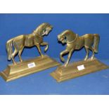 A pair of Brass Doorstops in the form of horses.