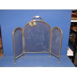 A 19th century three section brass Fireguard with wire grill, standing on ball feet, 24" tall.