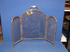 A 19th century three section brass Fireguard with wire grill, standing on ball feet, 24" tall.