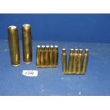 A small quantity of brass consisting of two sets of five empty bullet cases on stand,