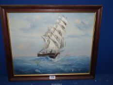 A wooden framed Oil on canvas depicting a Tall ship at sea with another on the horizon,
