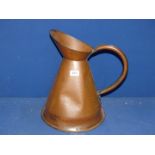 An antique Copper flagon, (dented).