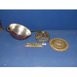 A brass horseshoe key rack, rabbit key rack, trivet and copper coated colander.