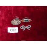 Three brooches; one filigree, one marcasite, plus another.