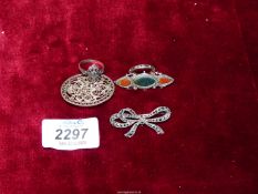 Three brooches; one filigree, one marcasite, plus another.