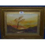 A small gilt framed Oil painting depicting a lonely tree on a mountain side with rolling hills and